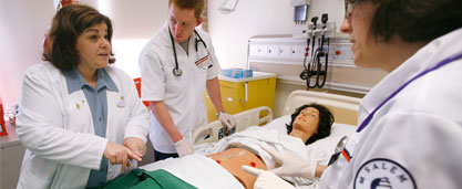 image of nursing student in clinical setting with patient